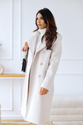 Langer Damenmantel mit doppelreihigem Verschluss, breitem Revers und Taschen - 1 - Jasminaboutique.com